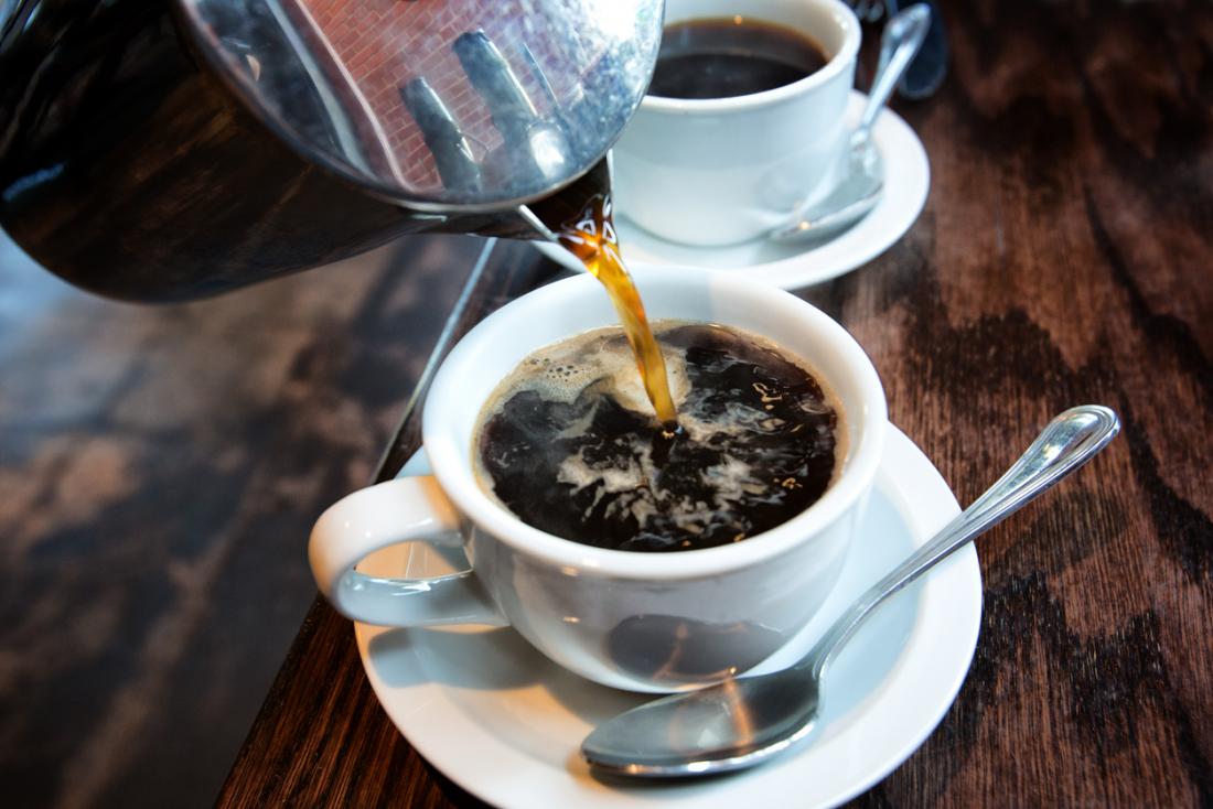 coffee being poured in a cup