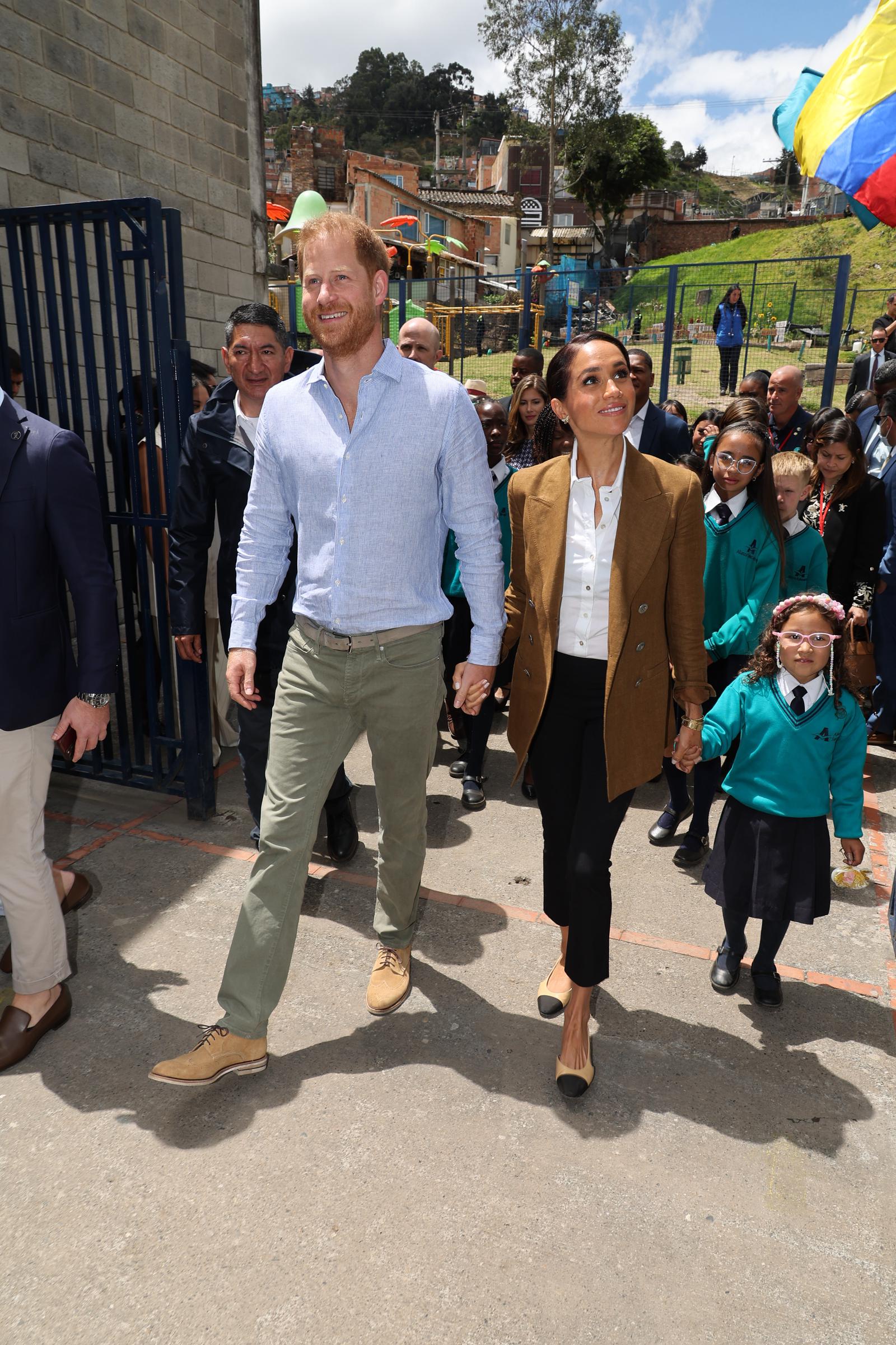 Prince Harry and Meghan Markle visiting Colegio La Giralda during their Colombia tour on August 16, 2024. | Source: Getty Images