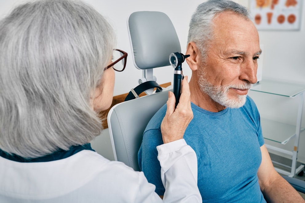 Doctor performing ear exam