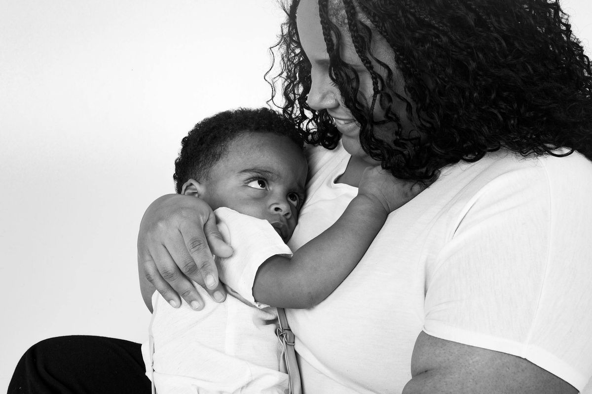 A woman hugging her son | Source: Pexels